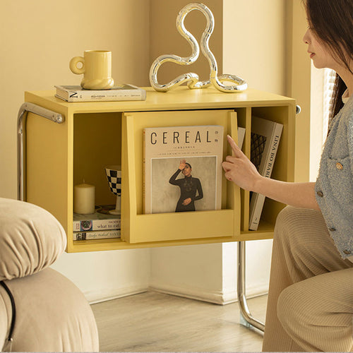 Front angled view of yellow Norbu console with storage compartments